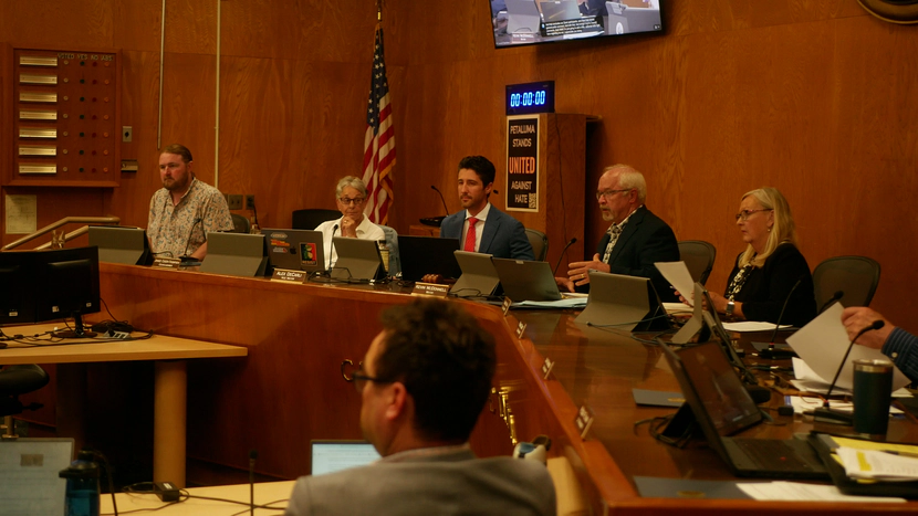 City council members looking at the crowd.