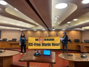 Two people holding banner